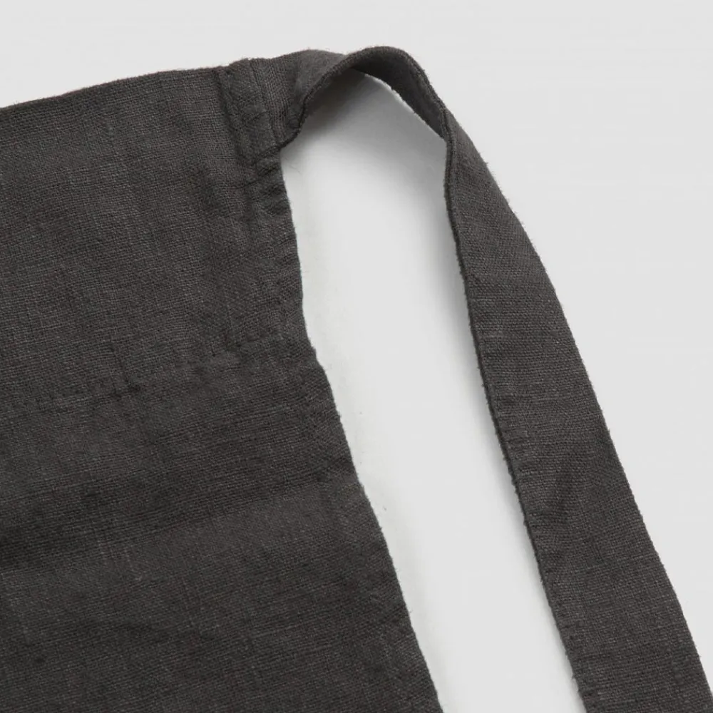 Viadurini Textile Küchen Schürzen-Schwarzes Leinen Küchenschürze mit Kristallen Niedriges Modell mit Tasche - Klicken